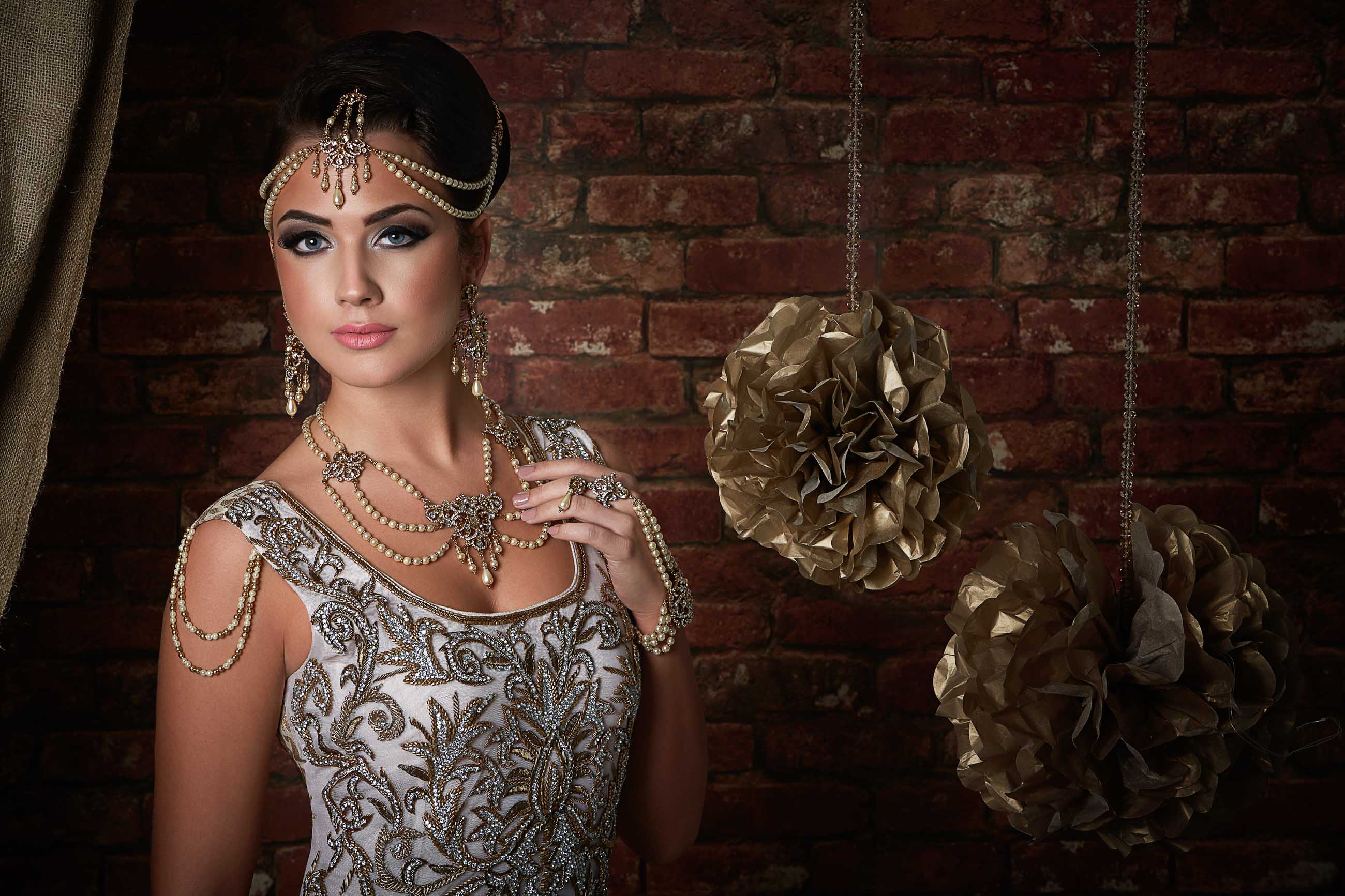 Bride wearing a white lengha and a Jazzy Bindi jewellery set with pearls