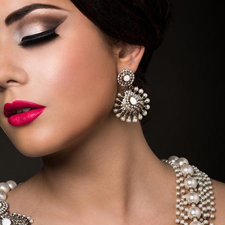 Bride wearing an elegant white pearl earnings and neckless